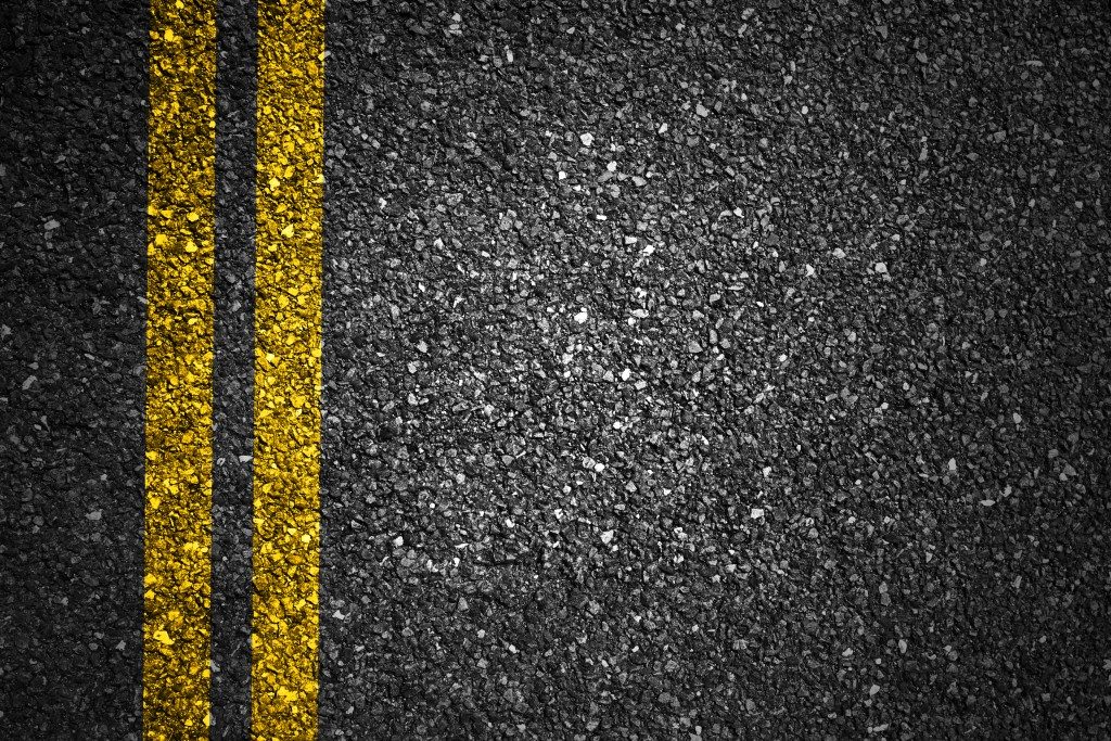 asphalt with yellow stripes