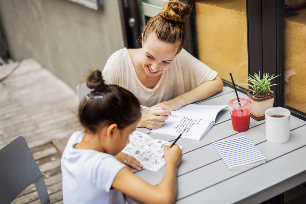 mom helping with child's assignment