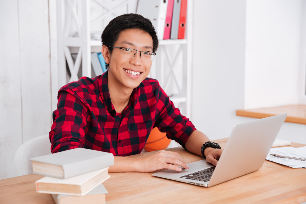 teenager using laptop