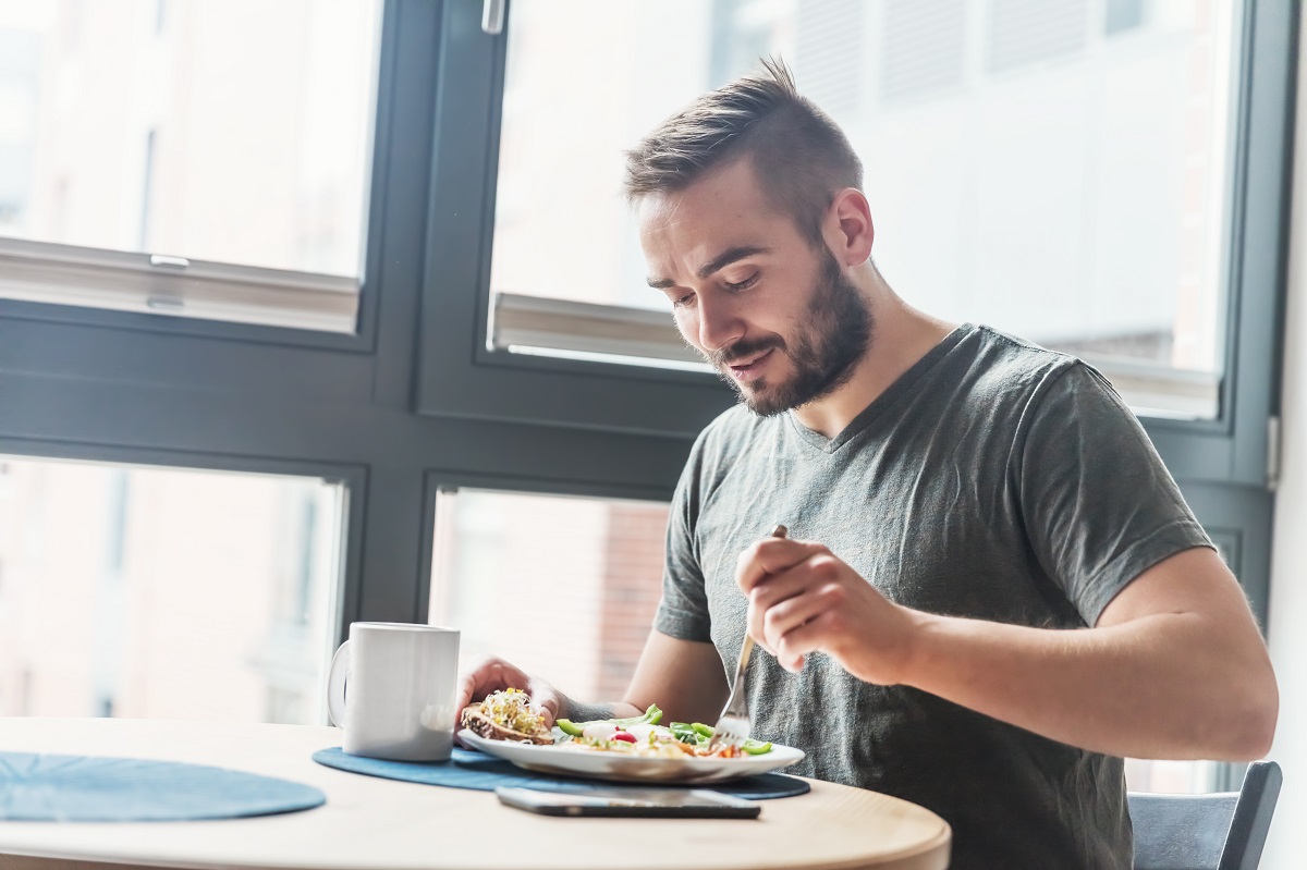 man eating his breakfast