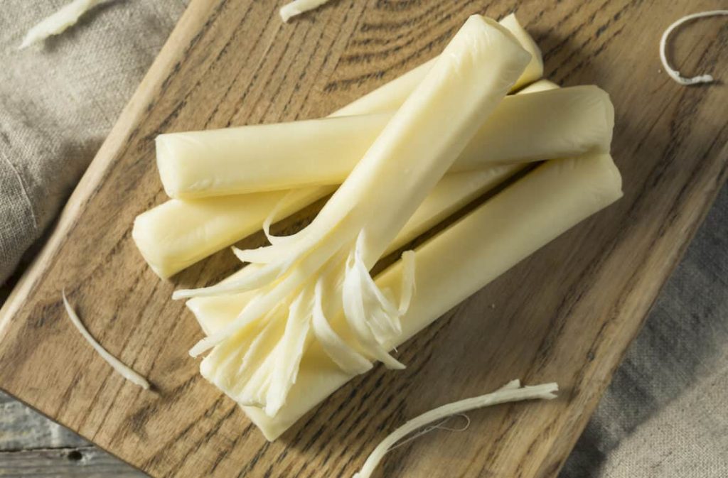 string cheese on wooden board