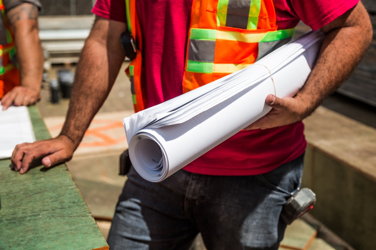 man holding blueprints