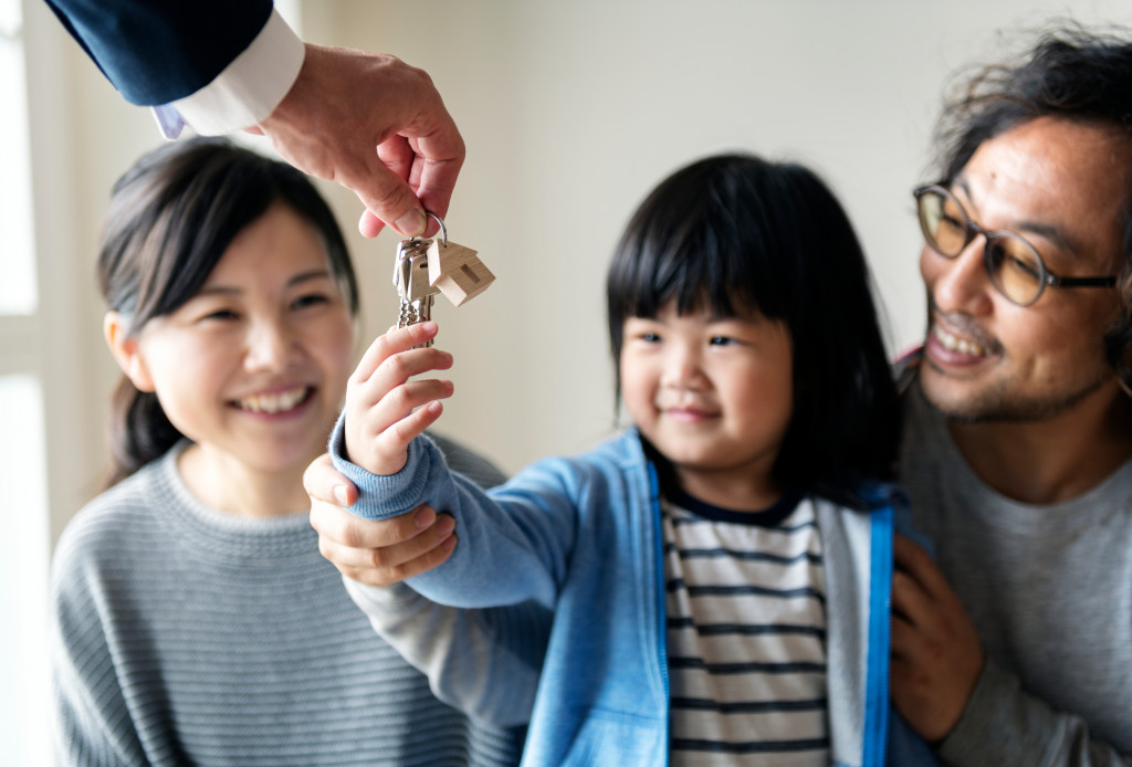 child receiving house keys