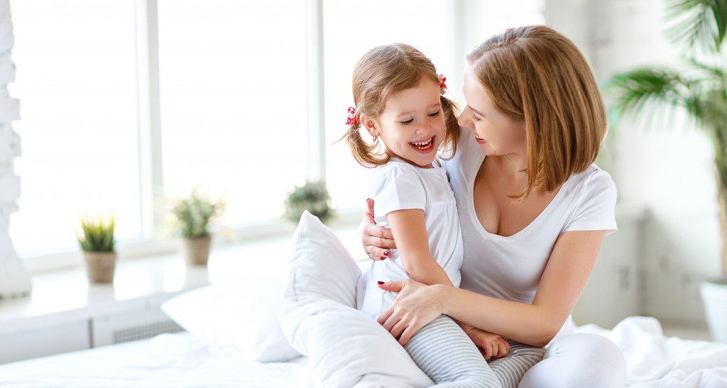 mother and daughter in bed