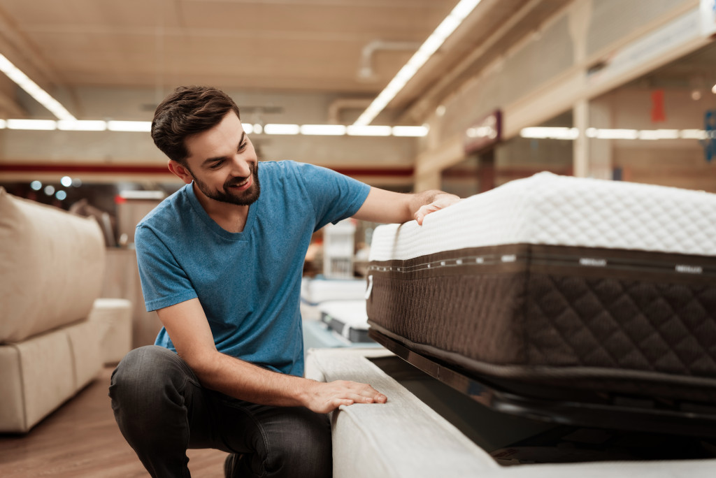 a person checking out on a mattress