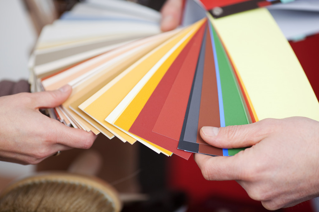 People browsing through paint swatches for paint