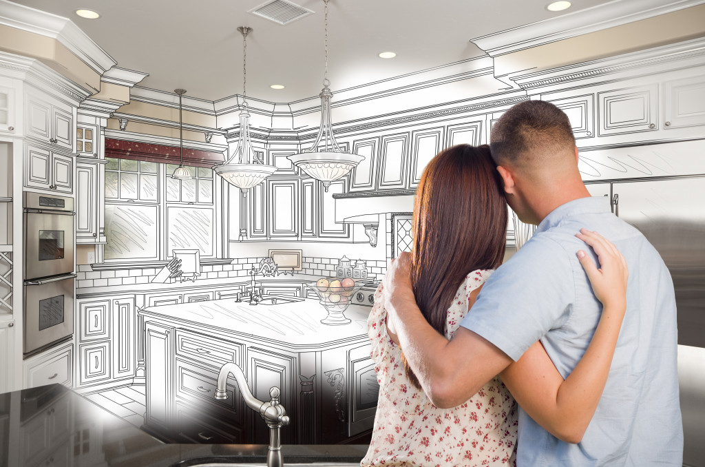 couple looking at the planned design of their home