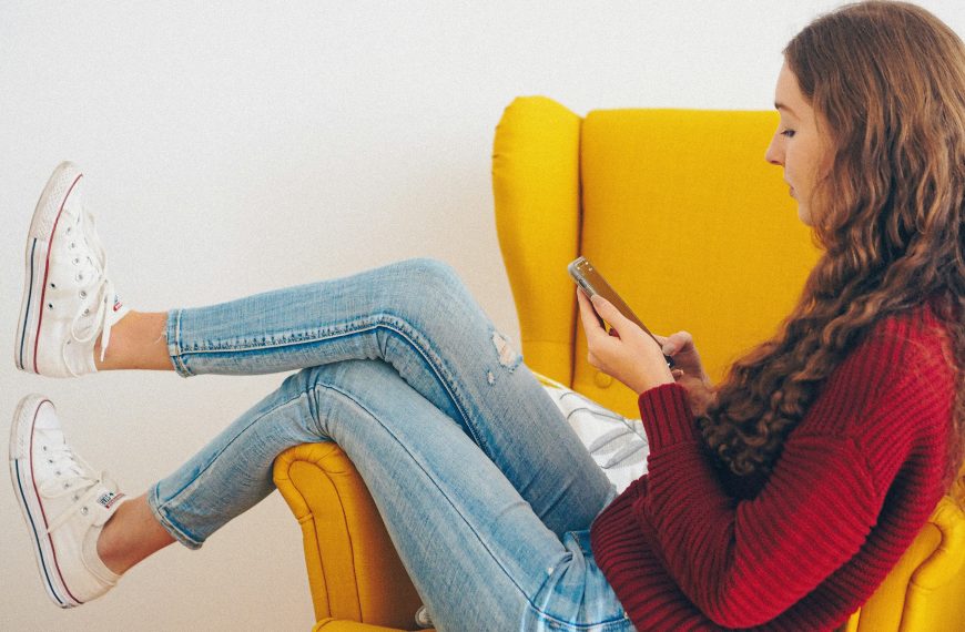 teen focused on her phone